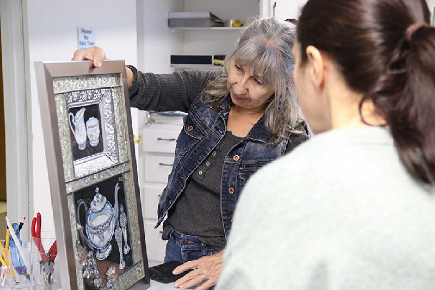 Artist Darlene Strong displays a stained glass work she made in honor of her mother, featuring her mother’s silverware. She has donated $5,000 worth of stained glass supplies and equipment to the Moosomin Visual Arts Centre, where she will teach stained glass classes.